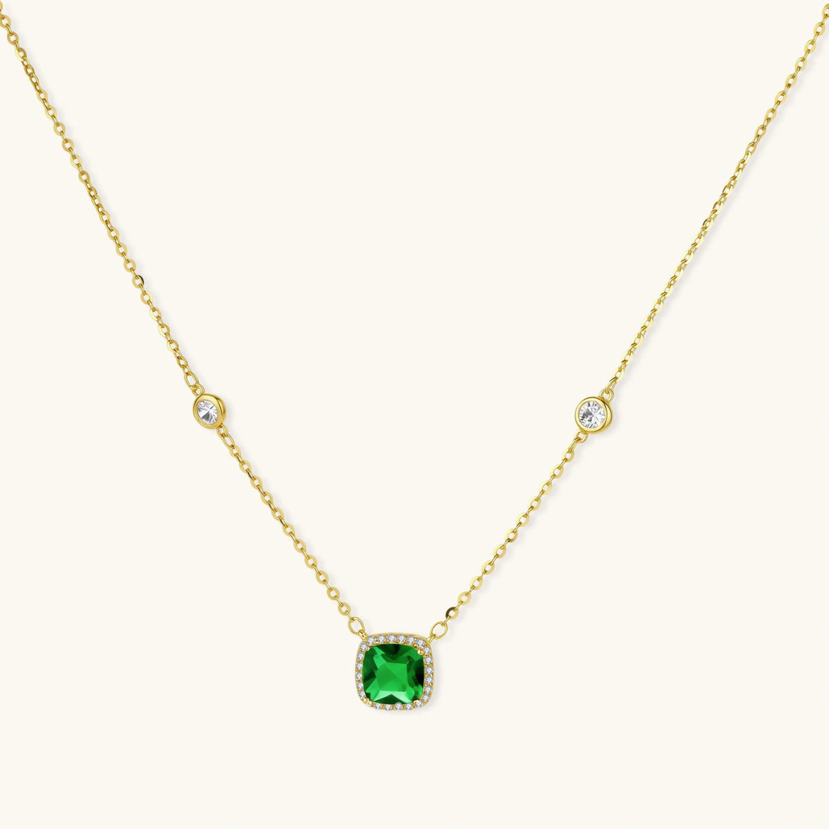 Emerald Dreams Necklace necklaces photographed for VENIER on a warm ivory product set