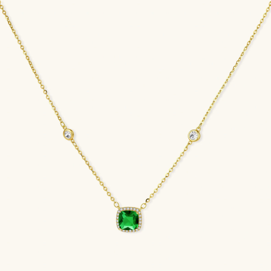 Emerald Dreams Necklace necklaces photographed for VENIER on a warm ivory product set