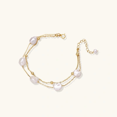 Baroque Pearl Cascade Bracelet bracelets photographed for VENIER on a warm ivory product set