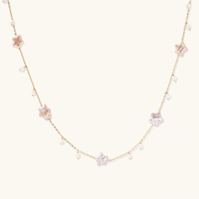 Starlit Pearl Necklace necklaces photographed for VENIER on a warm ivory product set