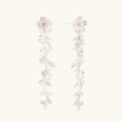 Floral Vine Drop Earrings earrings photographed for VENIER on a warm ivory product set