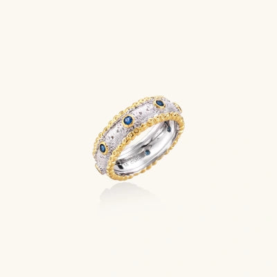 Byzantine Blue Band rings photographed for VENIER on a warm ivory product set