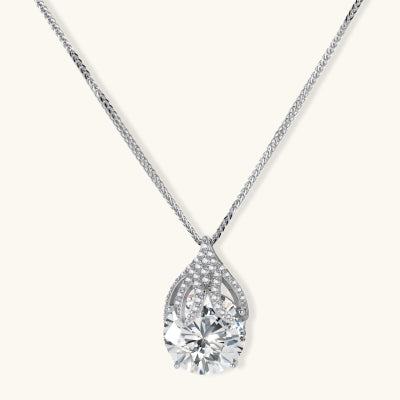 Teardrop Moissanite Necklace necklaces photographed for VENIER on a warm ivory product set