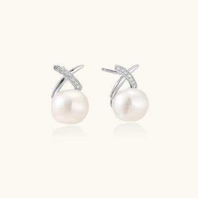 Pearl Kiss Studs earrings photographed for VENIER on a warm ivory product set