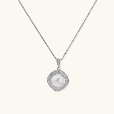 Halo Pearl Pendant necklaces photographed for VENIER on a warm ivory product set
