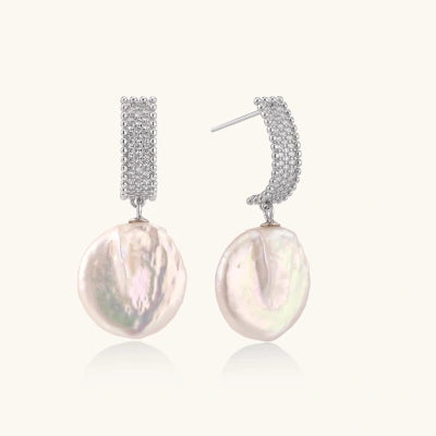 Baroque Pearl Drop Earrings earrings photographed for VENIER on a warm ivory product set