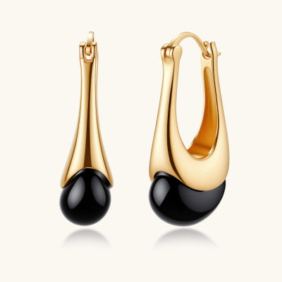 Midnight Drop Earrings earrings photographed for VENIER on a warm ivory product set