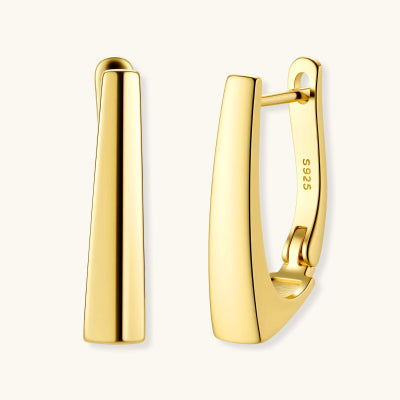 Golden Hour Huggie Earrings earrings photographed for VENIER on a warm ivory product set