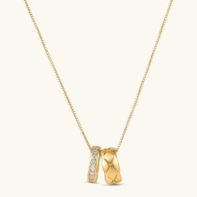 Twin Ring Necklace necklaces photographed for VENIER on a warm ivory product set